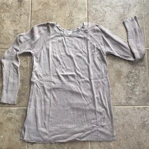 Taupe sweater with textured detail in the arms. Super cute for everyday wear!